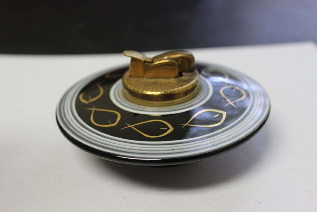 A Retro Evans Porcelain Lighter: 4 1/4 inches in diameter