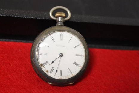 a Wattham Pocket Watch: as found - currently not working - for parts only - 1 1/2" in diameter