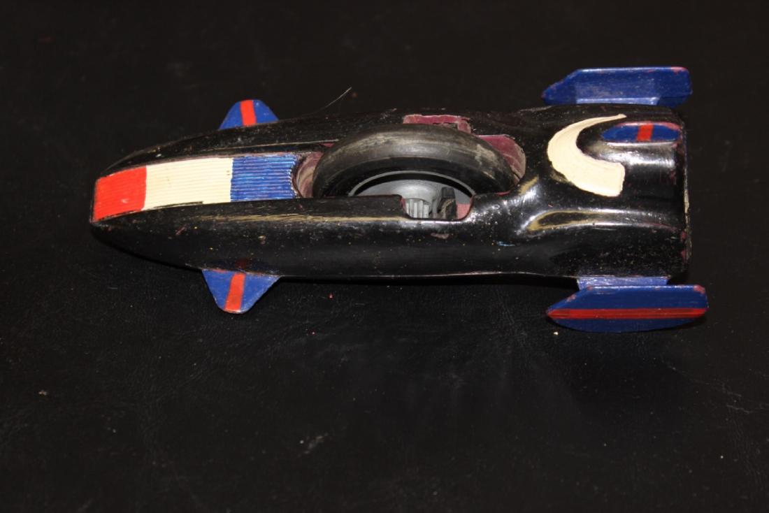 A Kenner SSP Mini Wooden Rocket: Single wheel - probably 1970's - 6 1/8 inches long