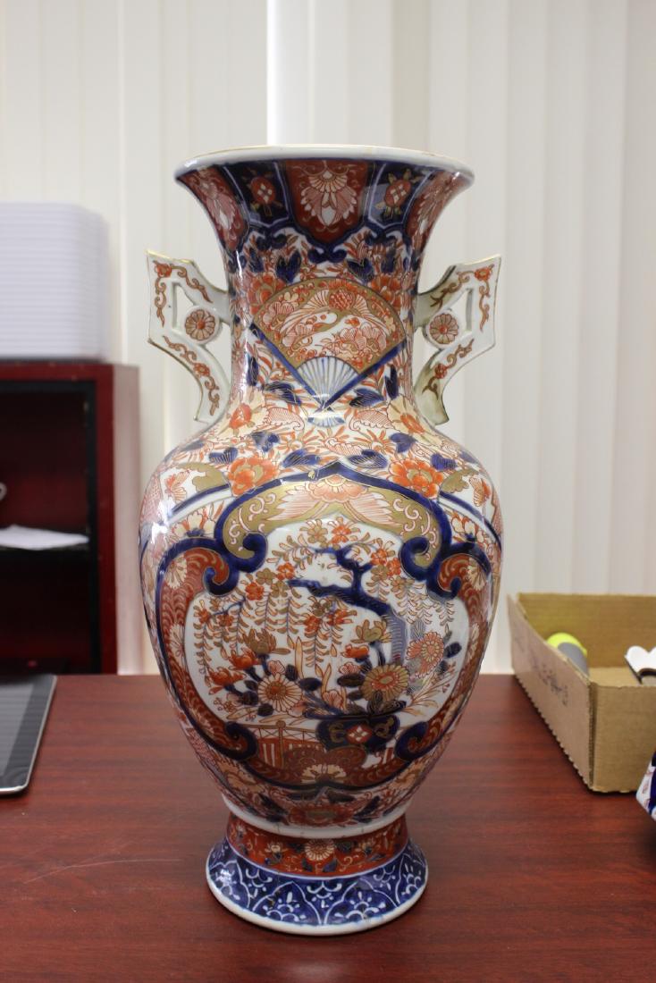 An Imari Vase: Please note: one handle possibly restored - 15 5/8" tall