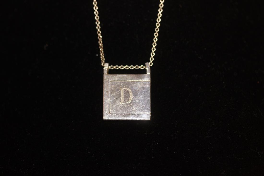 A Sliding Locket and Necklace: as shown