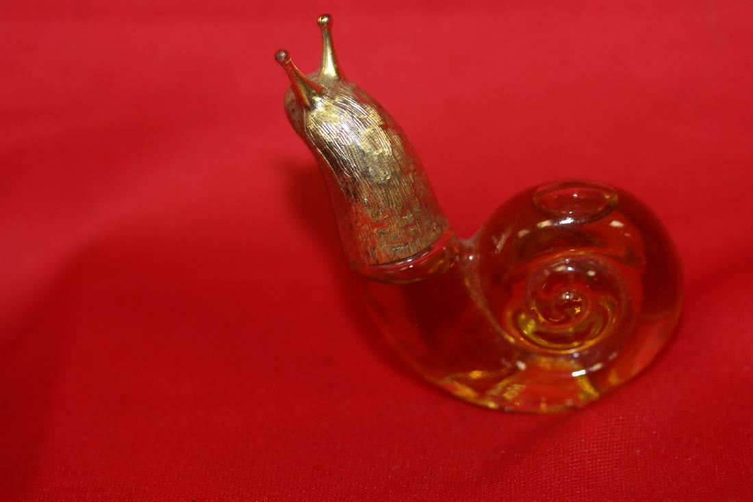 A Snail Form Perfume Bottle: with content