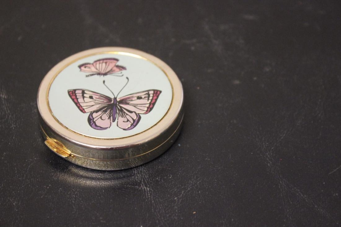 A Compact: 2 3/8" in diameter