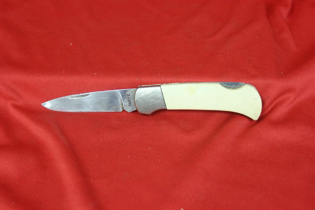 A Sabre Knife: 4" long when folded
