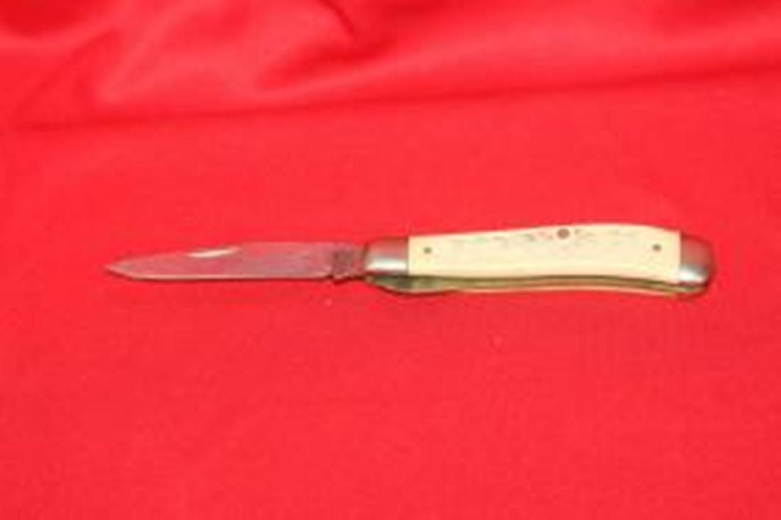 A Schrade Scrimshaw Pocket Knife: 4" long when folded