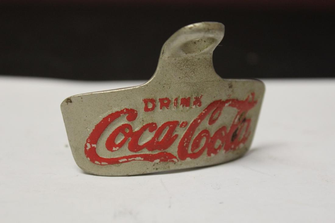 A Coca Cola Bottle Opener: By Starr X