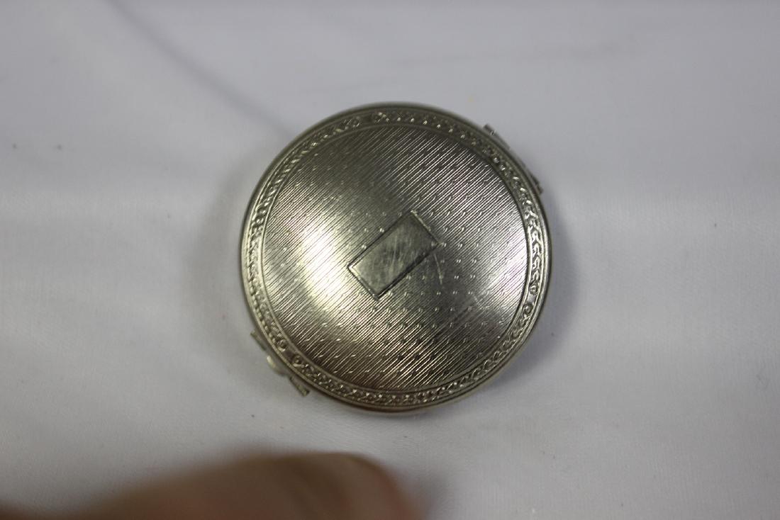 A Compact: 2" in diameter