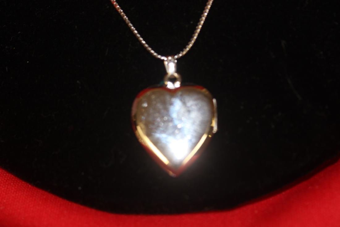 A Sterling Necklace and Locket Pendant: as shown