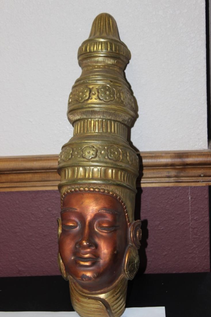 A Decorative Wall Hanger: 19 inches tall
