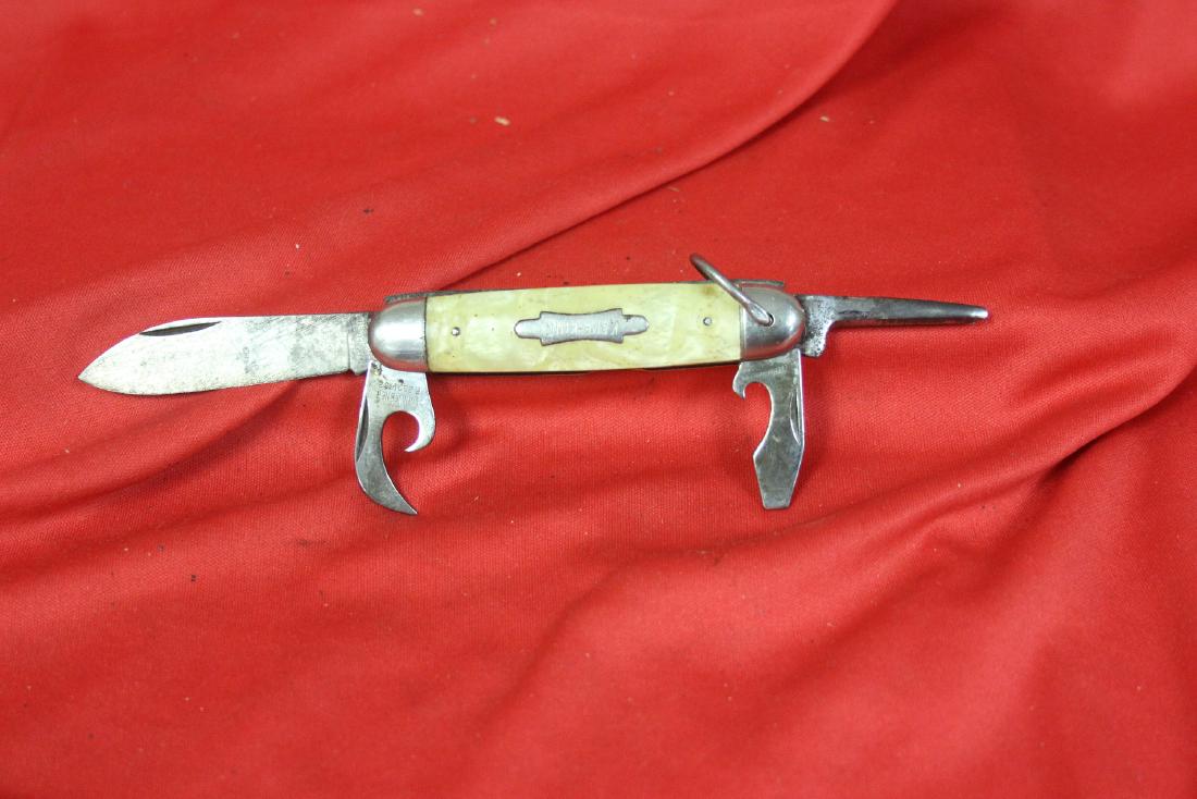 A Kamp King Pocket Utility Knife: 3 3/4" long when folded