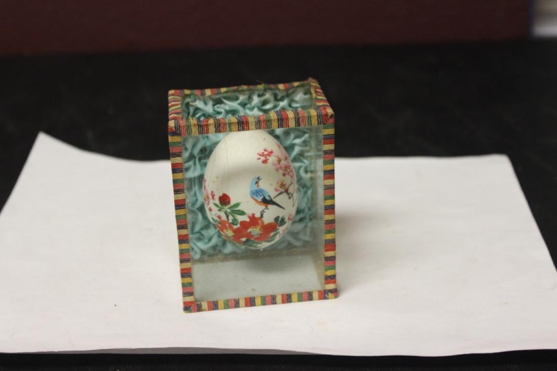 An Oriental Egg Inside a Glass Shadow Box: As shown on photos
