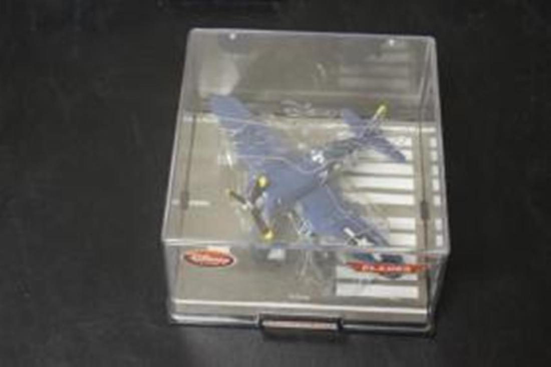 A Disney Store Die Cast Model Plane in Case: Case 6" x 6" x 4"
