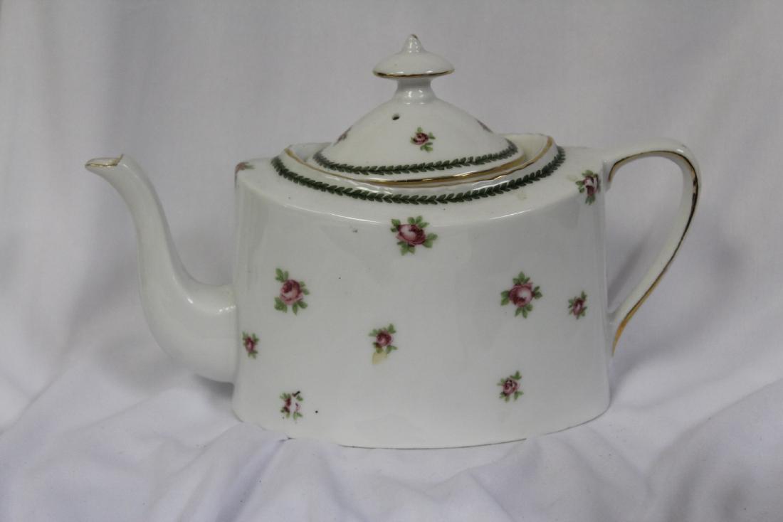 An Antique teapot: 7 1/4" long