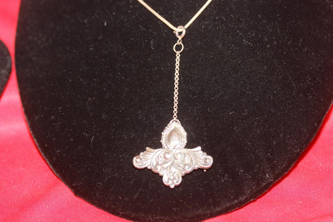 A Sterling Necklace and Pendant/Brooch Combination: as shown