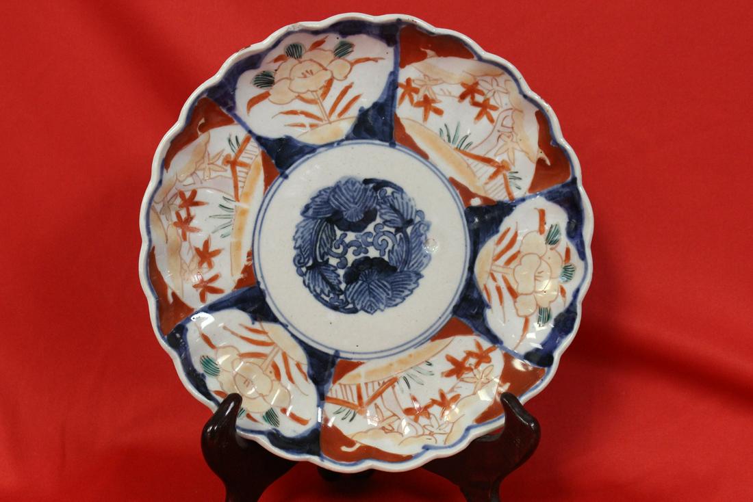 An Imari Plate: please note: chip - 8 1/2" in diameter