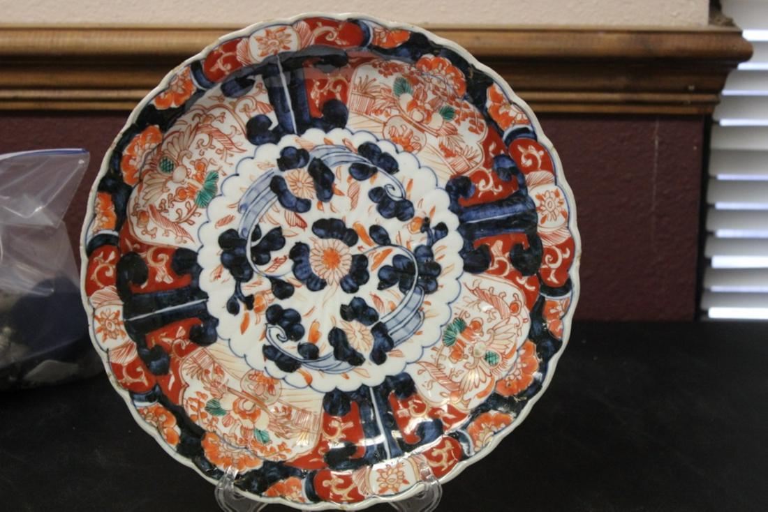 An Imari Plate: 10" in diameter - please note: small chips along the rim, or rim roughness - 19th century