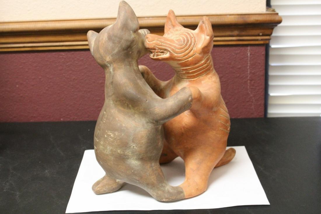 A Signed Mexico Clay Coyote and Dog Dancer Figure: 11 1/4" tall