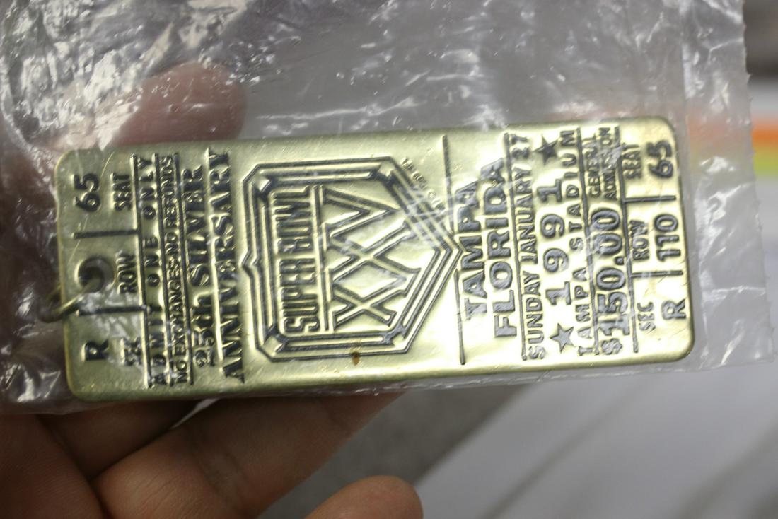 A Superbowl 25 Tampa florida Key Pendant: still in sealed bag - brass construction
