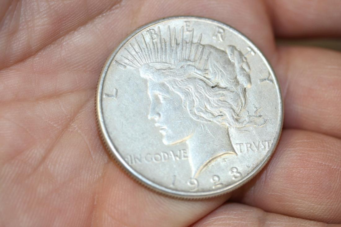 A 1923-S Peace Silver Dollar: as shown