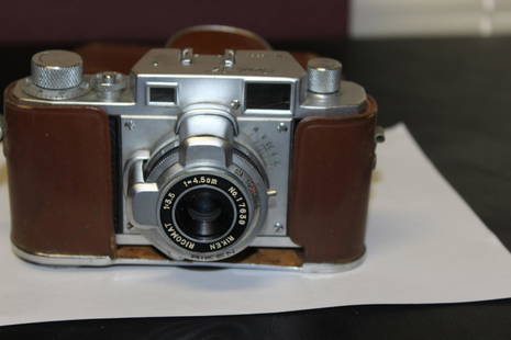 A Vintage Ricoh 35 Camera with Hoster: cannot tell if it is functioning or not - I am selling this camera as is