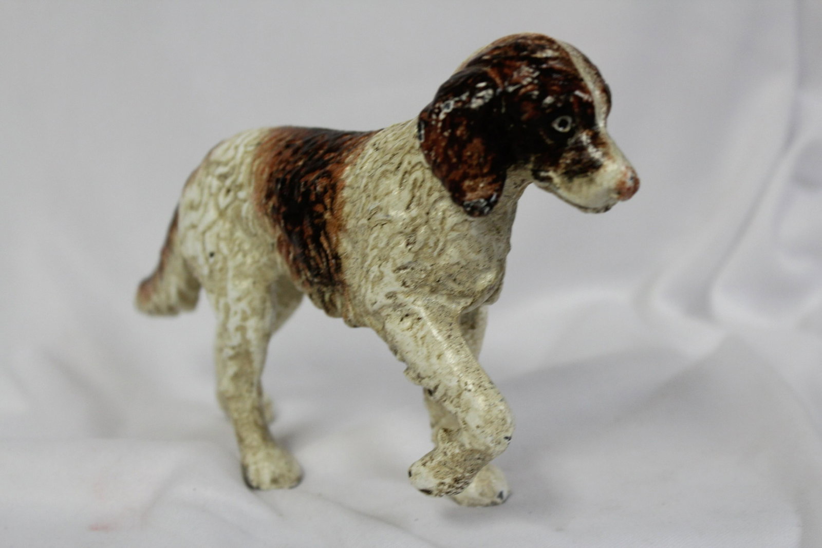 A Cast Iron Dog: 7 inches across