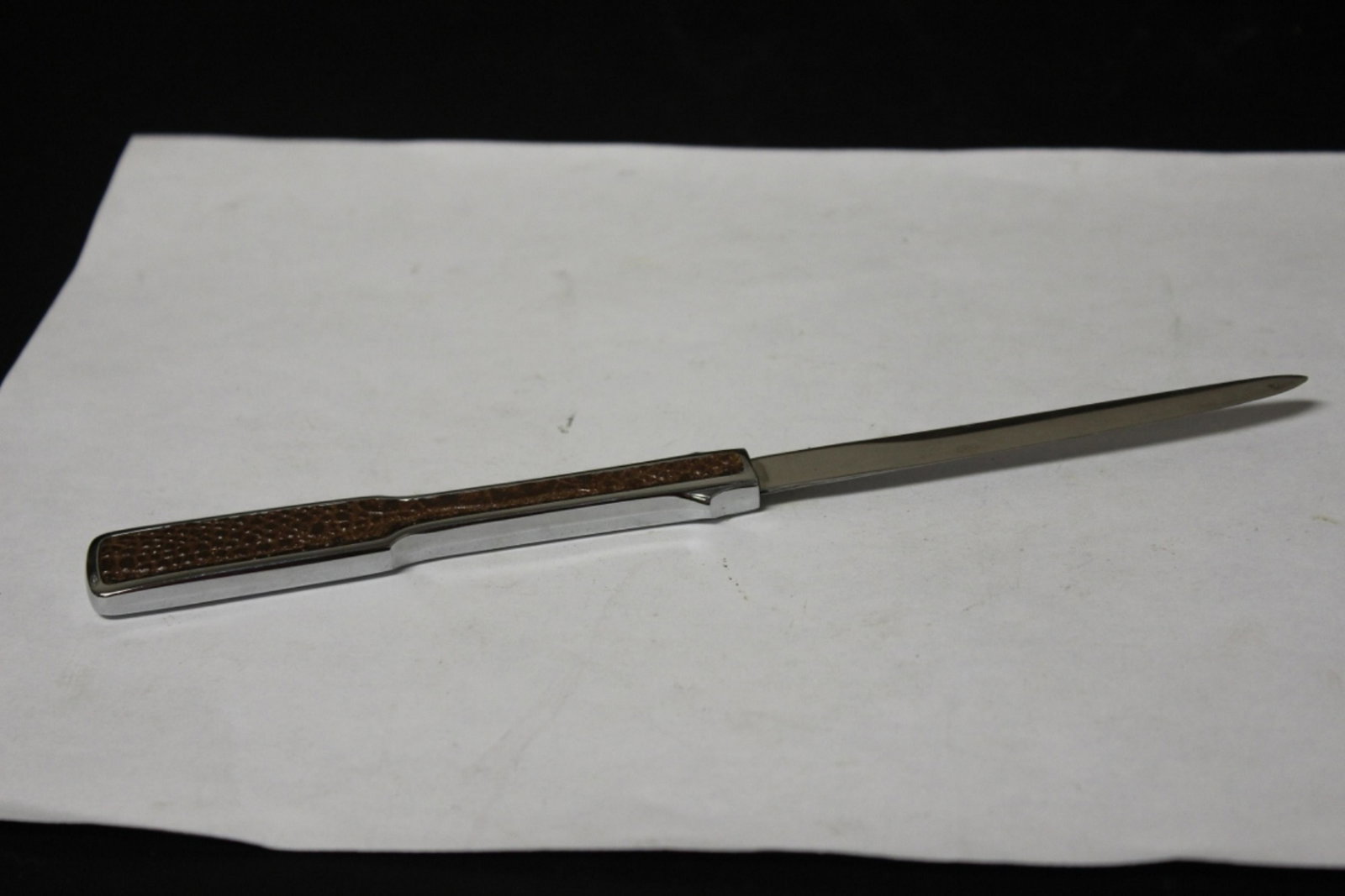 A Towle Leather and Stainless Steel Letter Opener: 8 1/2" long