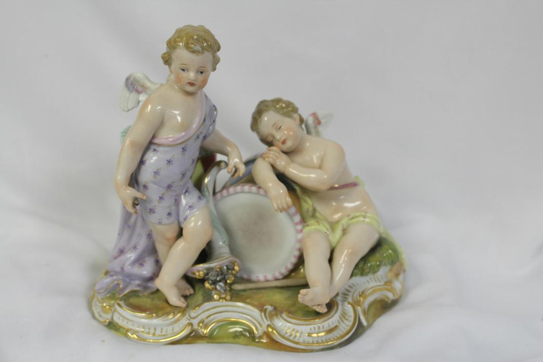 A Meissen Figeral Group: please note: minor chips as shown - well made - 20th century cross sword mark - 6 1/2" across