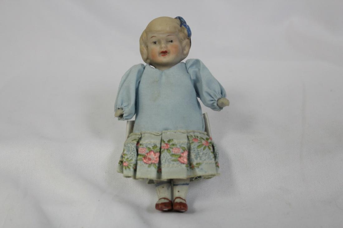 A Vintage Bisque Doll: 4" tall