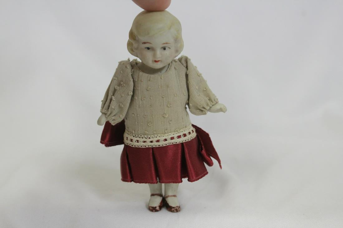 A Vintage Bisque Doll: 4" tall