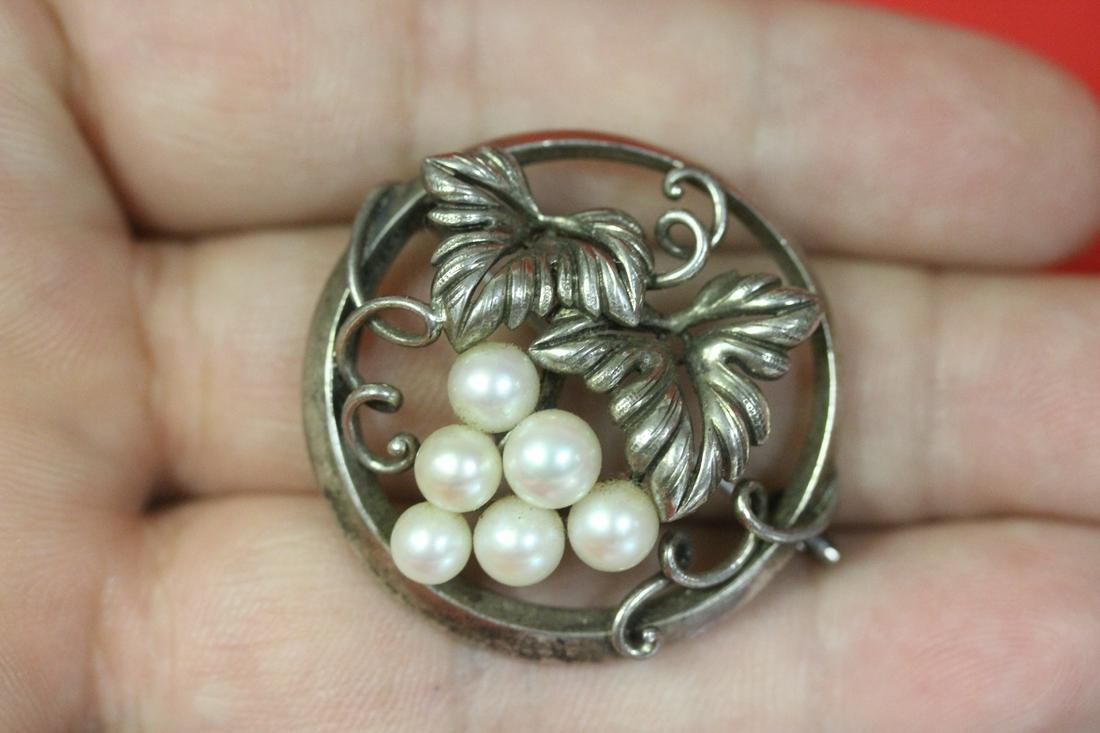A Signed Mikimoto Sterling and Pearl Brooch: as shown