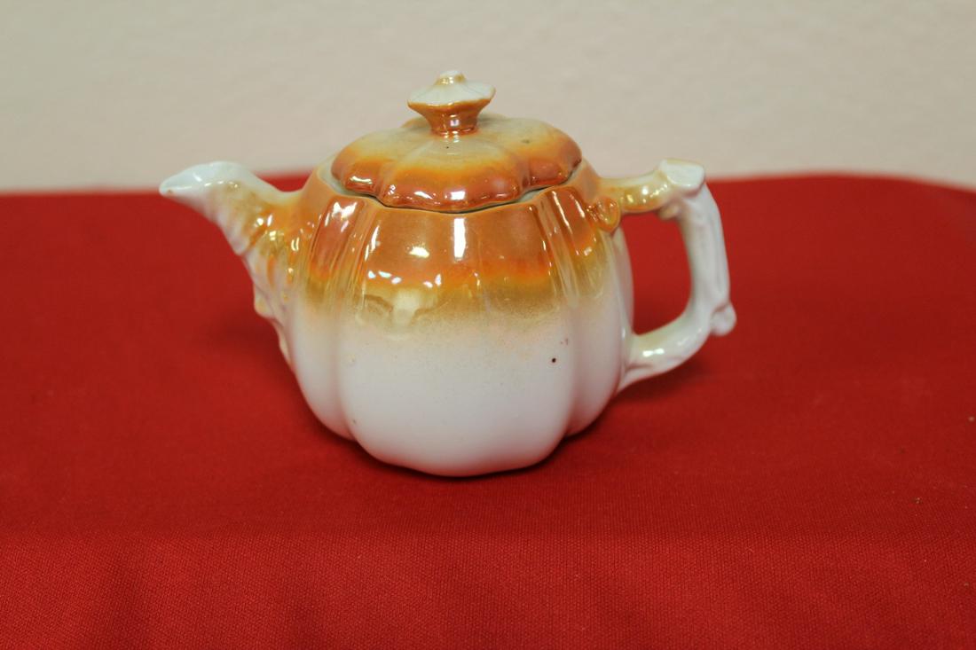 A Small Pumpkin Teapot: please note: chippped on top by opening - 3 1/2" tall
