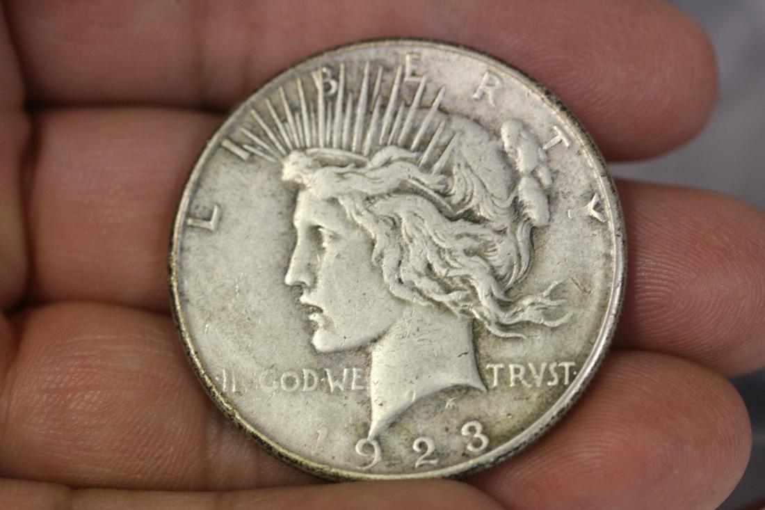 A 1923 Peace Silver Dollar: as shown