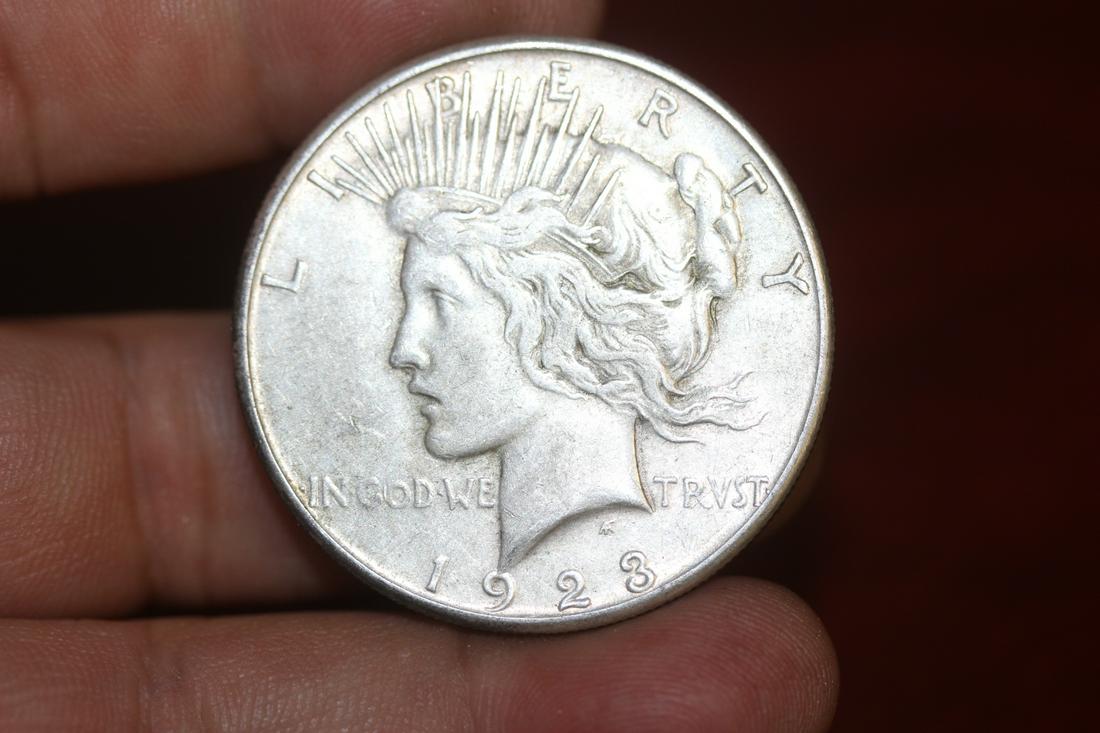 A 1923-S Peace Silver Dollar: as shown