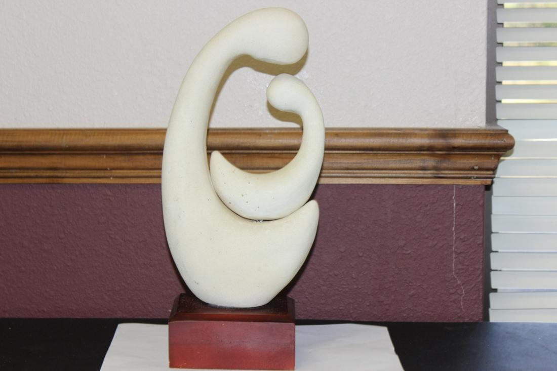 A Mother and Child Form Statue on Wood Base: Overall= 13 1/4 inches tall - looks to beceramic