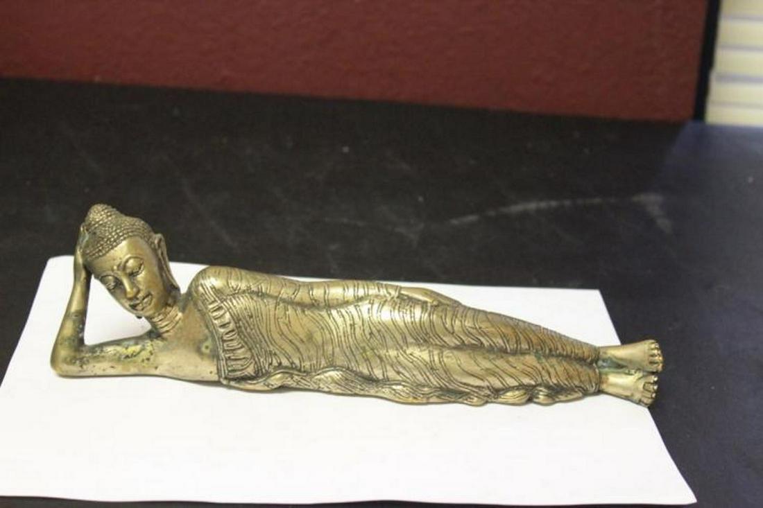 A Metal Reclining Buddha: 10 inches long