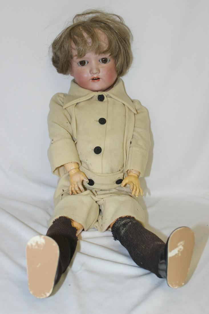 A Nippon 706 Antique Porcelain Doll: glass eyes, they blink - 24" tall