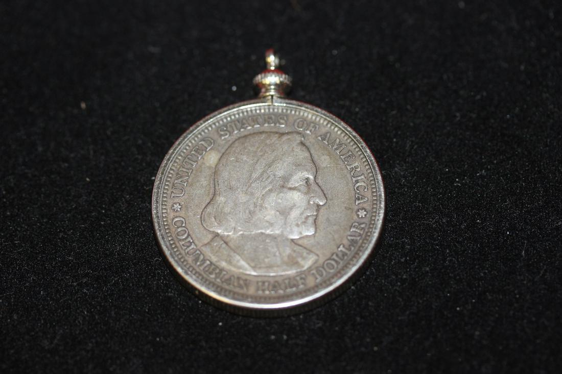 An 1893 Columbian Exposition Half Dollar: made into a pendant