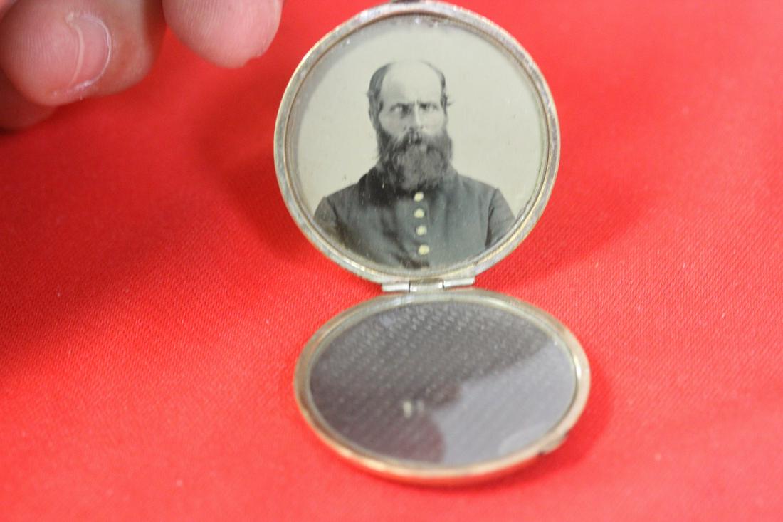 A Gold Filled Locket: with a civil war soldier tin type image or picture in it