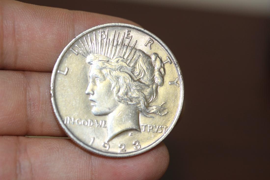 A 1923 Peace Silver Dollar: as shown