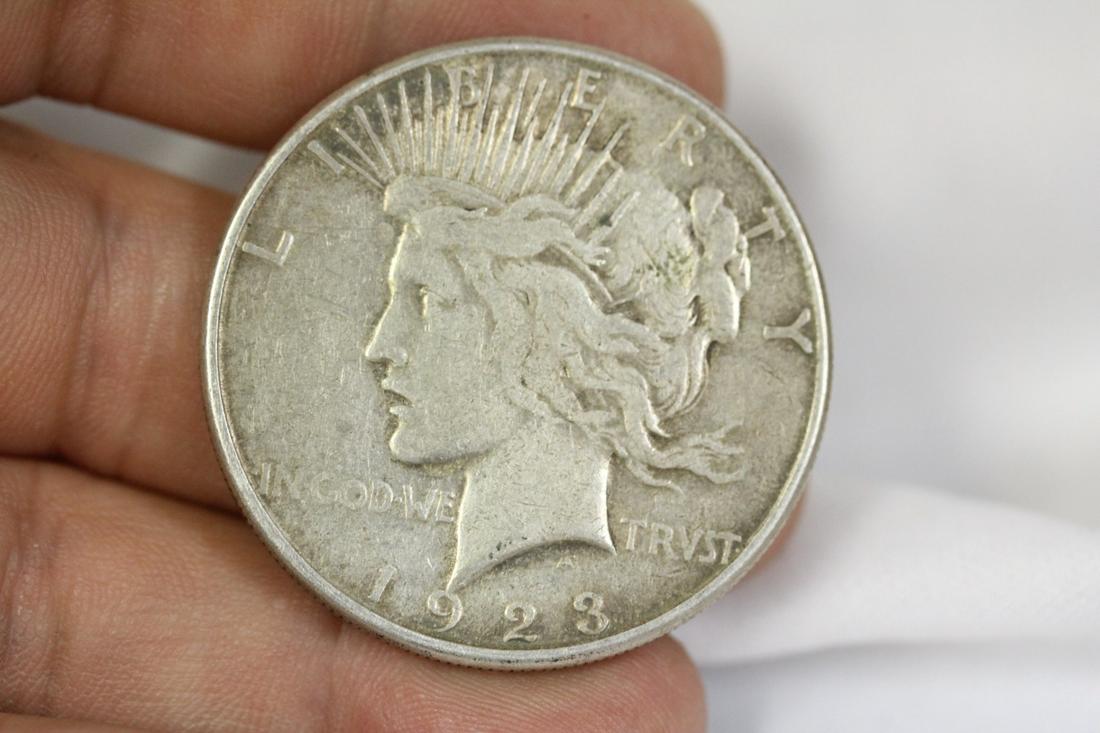 A 1923 Peace Silver Dollar: as shown