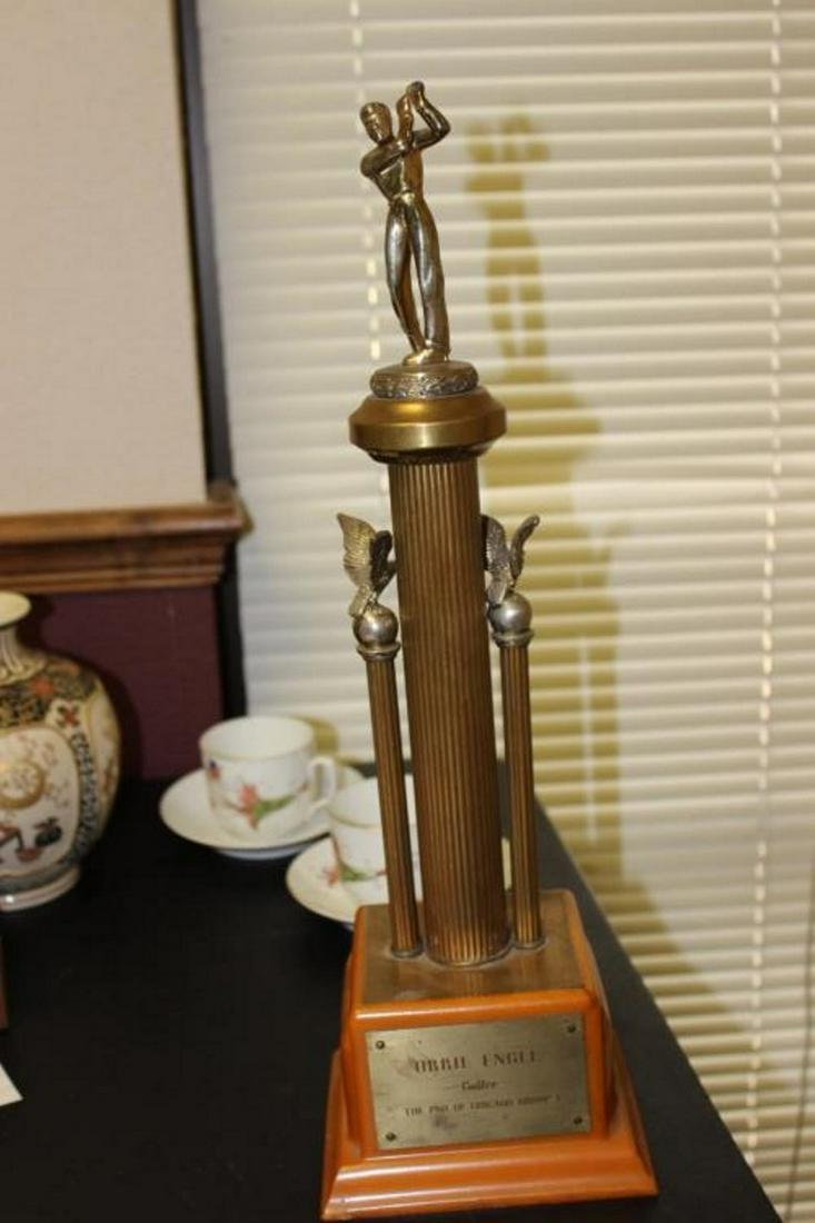 A Bakelite Golfer Trophy: 19 inches tall - please note: missing iron, side pedestal loose