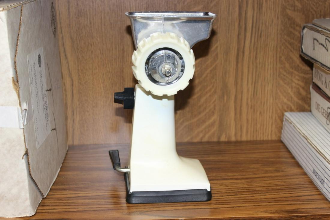 A Vintage Grind-O-Matic: Looks as if never been used. Comes with handle and probably cutter inside, the plastic bags, instructions book, box and other paperwork - NOT tested if it works or not