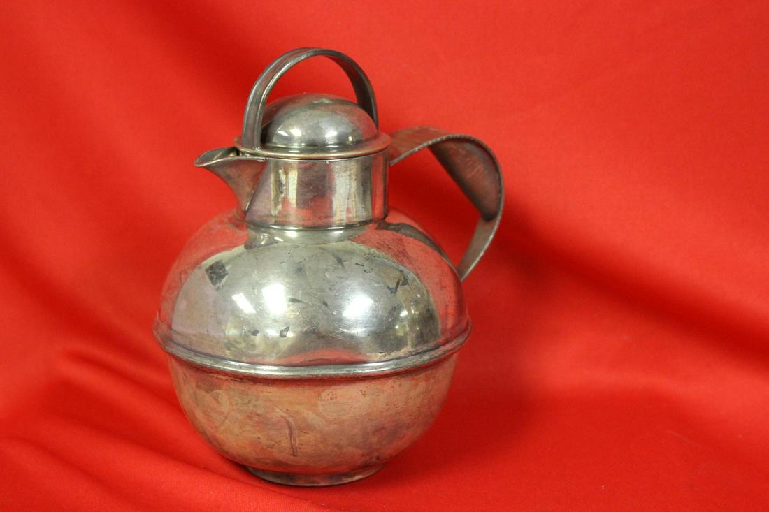 A Silverplated Teapot: 7 inches tall