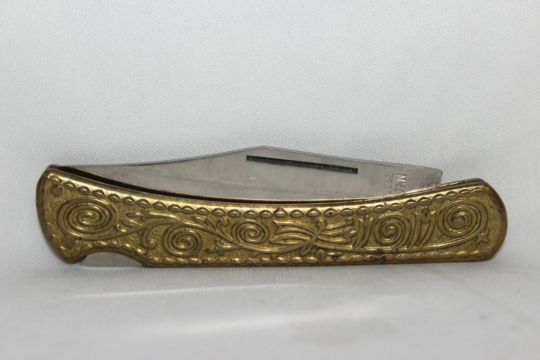 A Pocket Knife: 4" long when folded