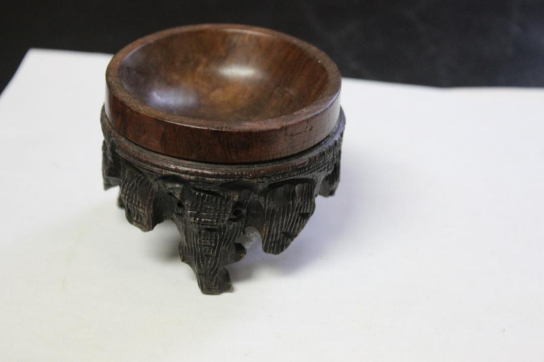 An Egg Stand: 3 1/4" in diameter x 2 1/2" tall - good carving
