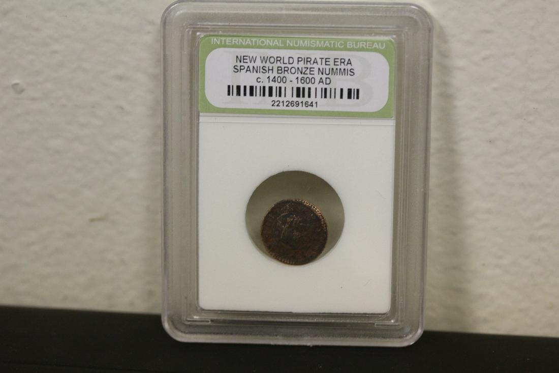 A Slabbed Spanish Bronze Nummis Coin: New World pirate era - c1400-1600 AD