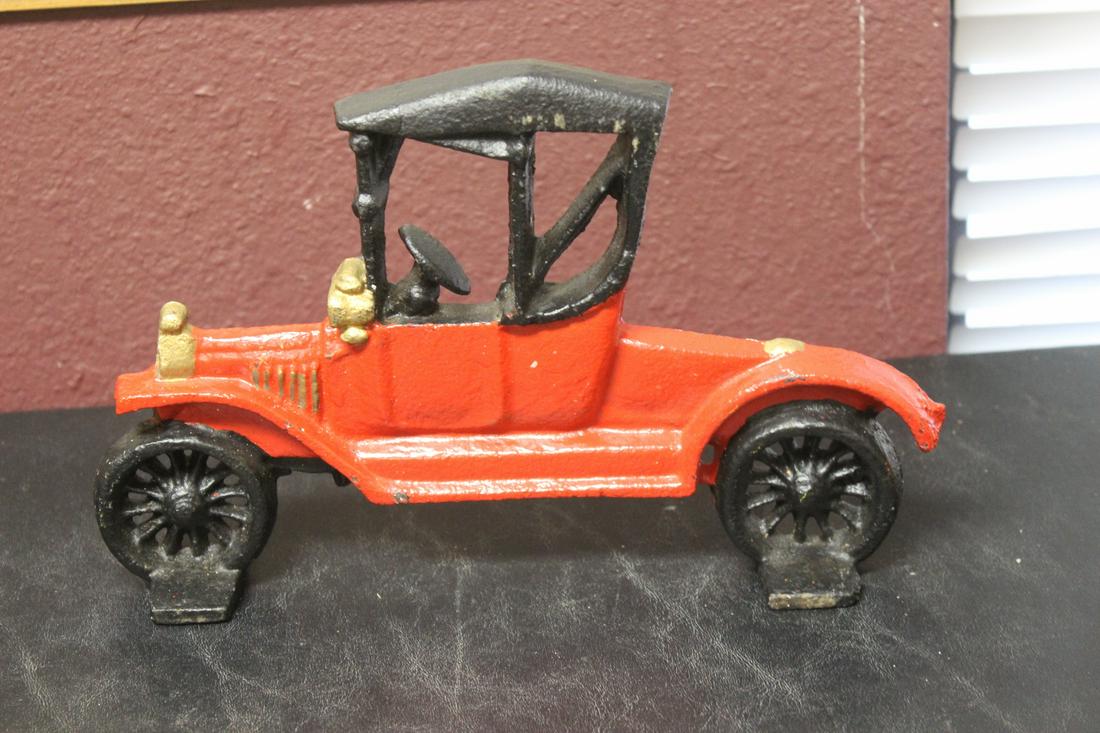 A Cast Iron Door Stopper: in a manner of an old car - 10 1/2" long