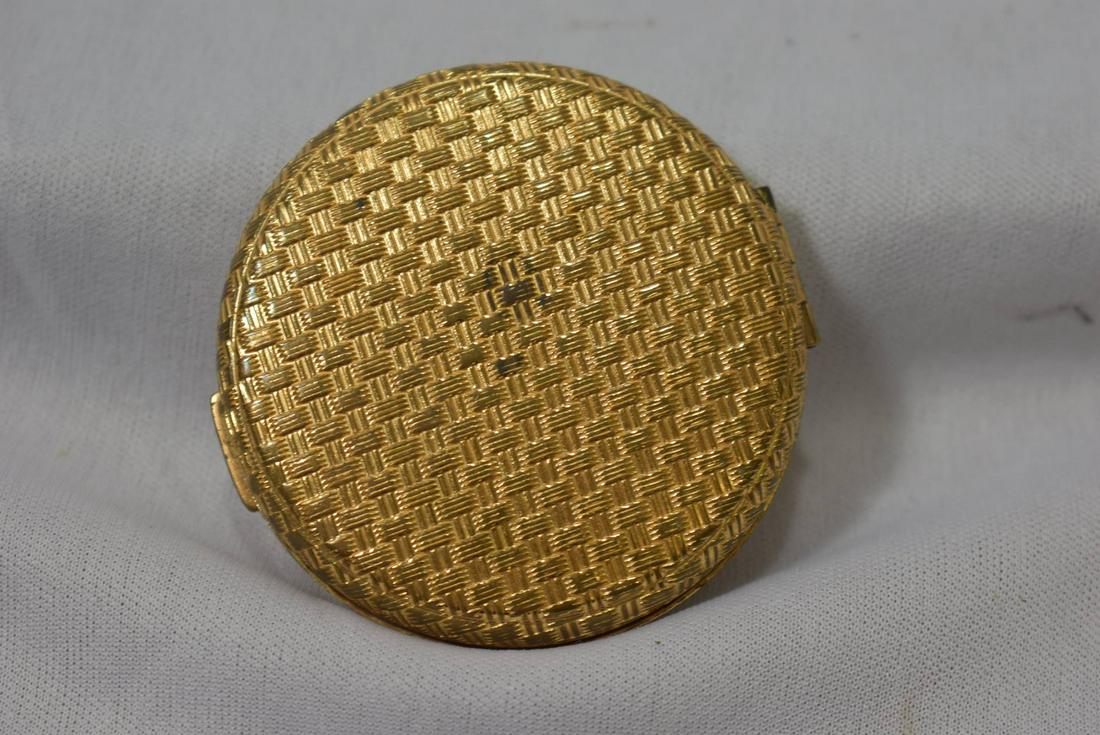 An Elizabeth Arden Compact: 2 1/4" in diameter