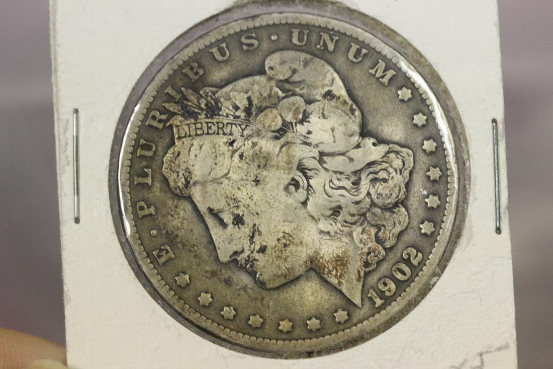 A 1902 Morgan Silver Dollar: as shown