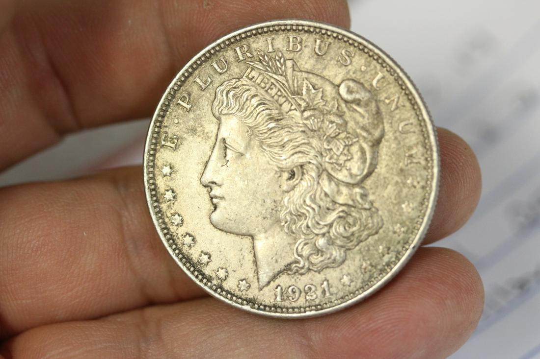 A 1921 Morgan Silver Dollar: as shown